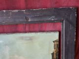 une photo d'une photo d'un bâtiment se reflétant dans un miroir