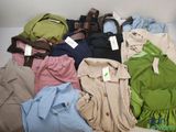 a lot of clothes that are sitting on the floor
