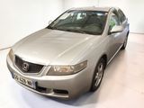 a picture of a silver honda accord car in a white room