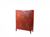 a red cabinet that has a drawer on top of it