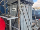 a red barrel sitting in the back of a truck