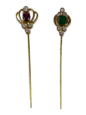 a pair of emerald and diamond hair pins