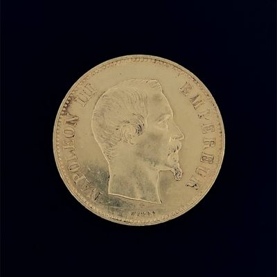 l'image d'une pièce d'or sur laquelle figure le visage d'un homme