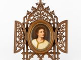 an antique picture frame with a painting of a woman in a white dress