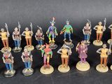 many figurines of different types and sizes on the table