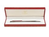 a pen in a red box on a white background