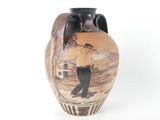 a vase that has a picture of a man on it