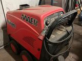 a red machine that is sitting in the garage