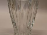 a glass vase that is sitting on a table
