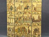 un vieux paravent orné d'une peinture représentant des personnages et des animaux