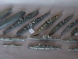 a lot of small ships that are on a table