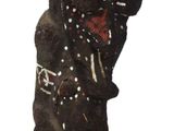 a statue of a bear that is on a white surface