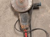 an image of a drill on the ground with a cord