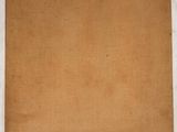 a piece of brown paper on a white surface