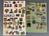 many different pins and magnets on a table