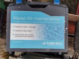 a sign that says kereo kit maintenance on the back of a bike