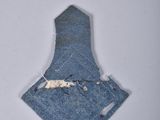 a picture of a piece of denim with a hole in it