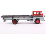 a toy truck that is sitting on a white surface