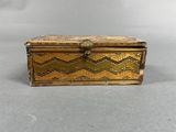 an old wooden box sitting on top of a table