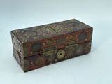a small wooden box with many different designs on it