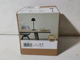 a box with a lamp on top of it on a table
