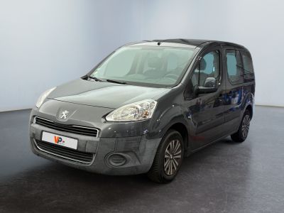 the small grey van is parked in a room with a black floor