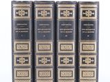 a set of four books sitting on top of each other