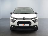 the front of a white citrole parked in a white room