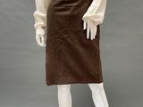 an image of a mannequin wearing a brown skirt and white shirt