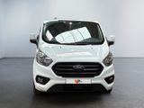 the front of a white ford transit van parked inside of a building