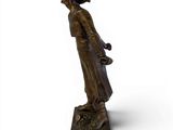 bronze statue of a woman holding a basket of flowers on a base