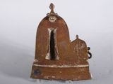 a small statue of a horse with a bell on it ' s back