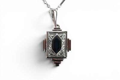 a close up of a locke with a chain on a white background