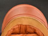 a close up of a hat on a black surface