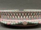 a bowl with a decorative design on it on a table