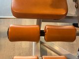 a close up of a bench with a pair of dumbs on it
