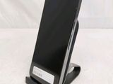 a cell phone that is sitting on top of a stand