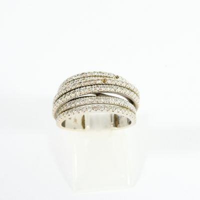 a close up of a diamond ring on a white surface