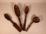 three wooden spoons and two wooden spoons on a white surface