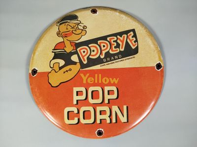 une enseigne jaune en forme de pop-corn accrochée au mur