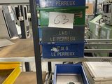 many boxes that are stacked on a shelf in a factory