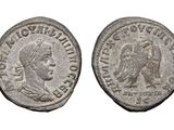 a silver coin with an image of a man and a woman on it