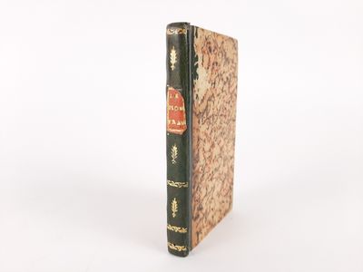 a close up of a book sitting on top of a white surface