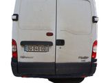 a white van that is parked on the side of the road
