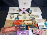 many different types of cards and envelopes laid out on a table
