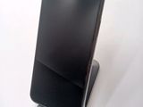a cell phone that is sitting on top of a stand
