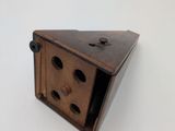 a small wooden box with holes in it