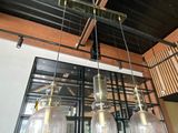 a large glass chandelier hanging from the ceiling of a restaurant