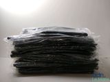 a pile of black cell phones sitting on a table