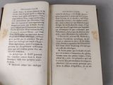 an open book that is sitting on a table